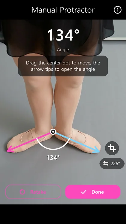Manual protractor measuring an angle on a photo