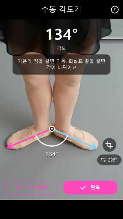 Manual protractor measuring an angle on a photo